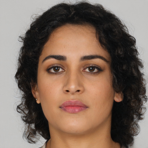 Neutral latino young-adult female with long  brown hair and brown eyes