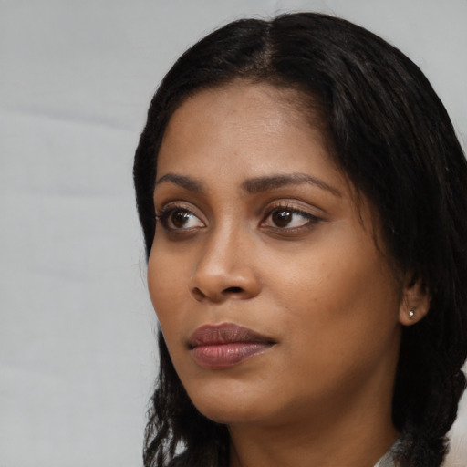 Neutral black young-adult female with long  black hair and brown eyes