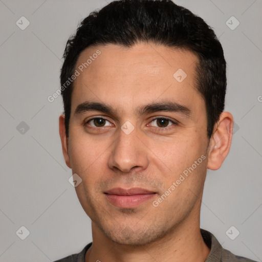 Joyful white young-adult male with short  black hair and brown eyes