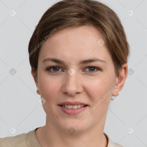 Joyful white young-adult female with short  brown hair and grey eyes