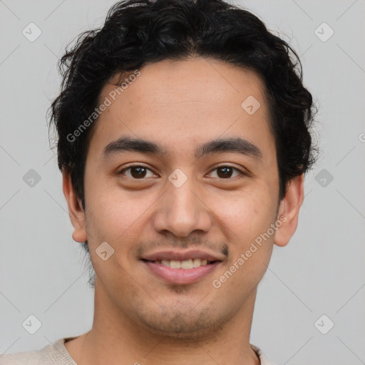 Joyful latino young-adult male with short  brown hair and brown eyes