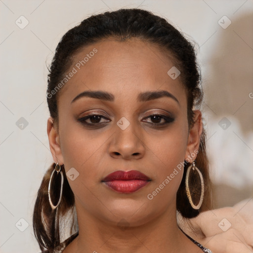 Joyful latino young-adult female with long  brown hair and brown eyes