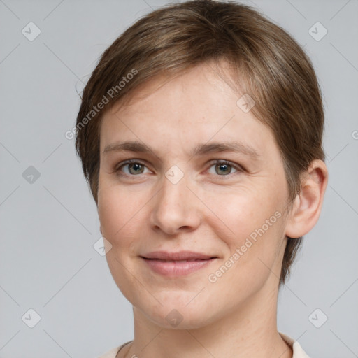 Joyful white young-adult female with short  brown hair and grey eyes