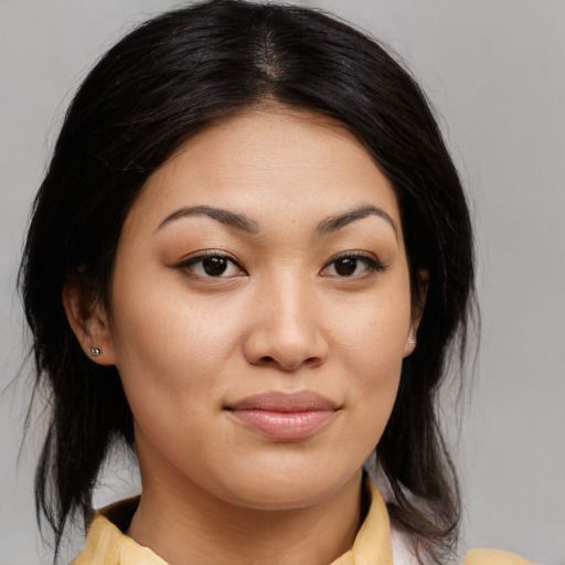 Joyful asian young-adult female with medium  brown hair and brown eyes