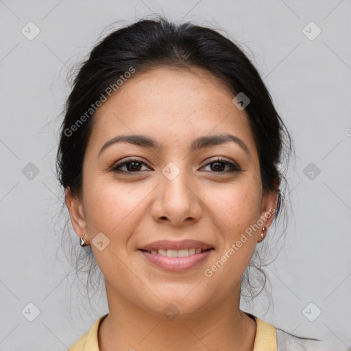 Joyful latino young-adult female with medium  brown hair and brown eyes