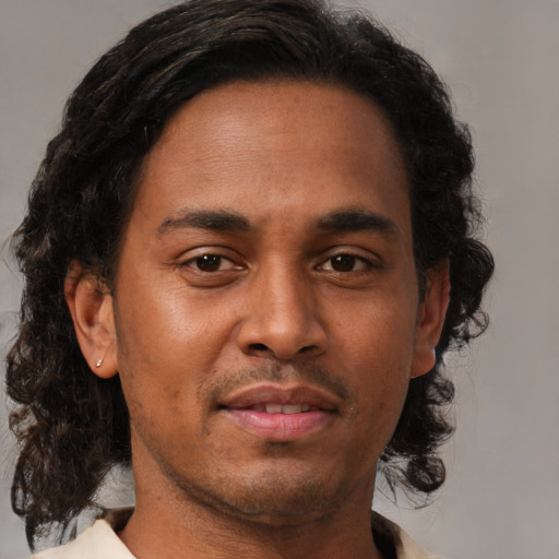 Neutral black young-adult male with medium  brown hair and brown eyes