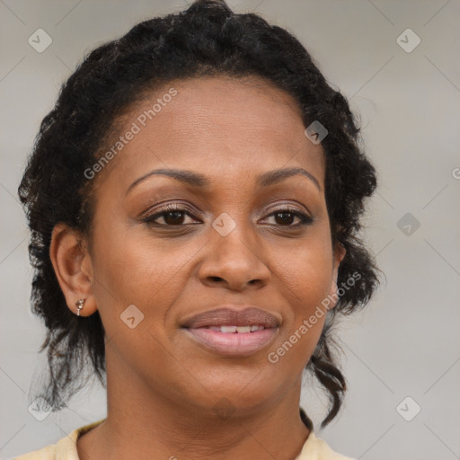 Joyful black adult female with medium  brown hair and brown eyes