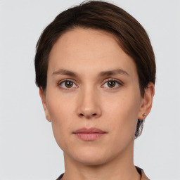 Neutral white young-adult female with short  brown hair and brown eyes