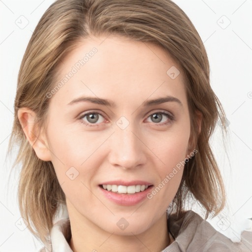 Joyful white young-adult female with medium  brown hair and blue eyes