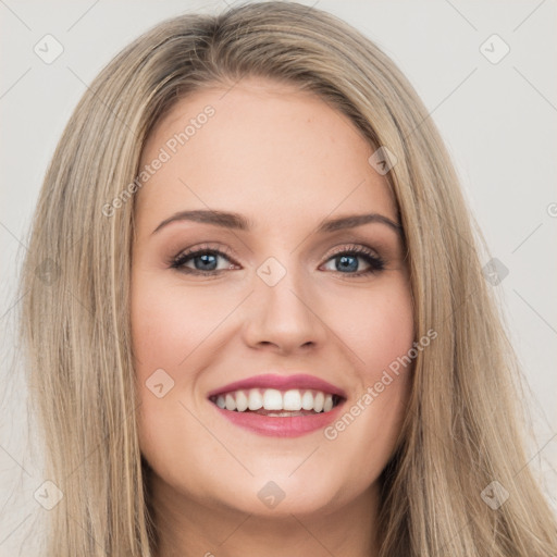 Joyful white young-adult female with long  brown hair and green eyes