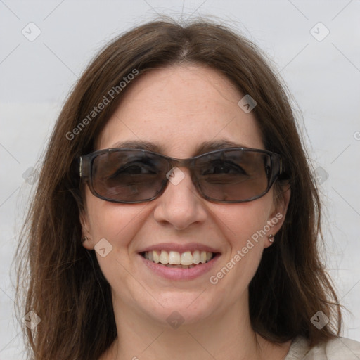 Joyful white young-adult female with medium  brown hair and blue eyes