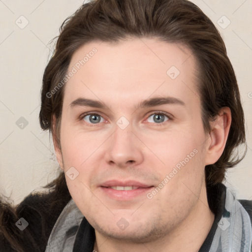 Joyful white young-adult male with medium  brown hair and brown eyes