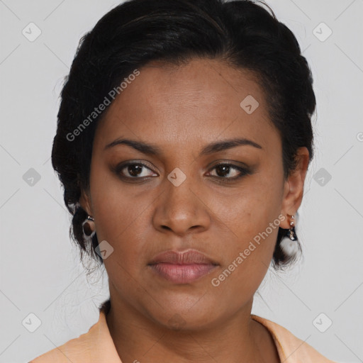 Joyful latino young-adult female with medium  brown hair and brown eyes