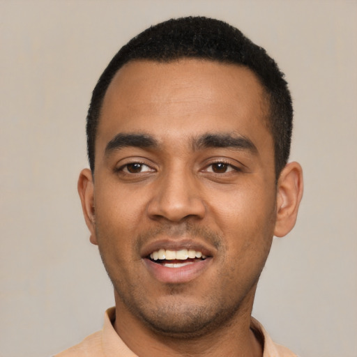 Joyful latino young-adult male with short  black hair and brown eyes