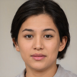 Neutral asian young-adult female with medium  brown hair and brown eyes