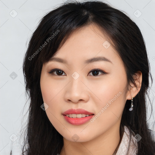 Joyful asian young-adult female with long  brown hair and brown eyes