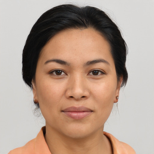 Joyful asian young-adult female with medium  brown hair and brown eyes