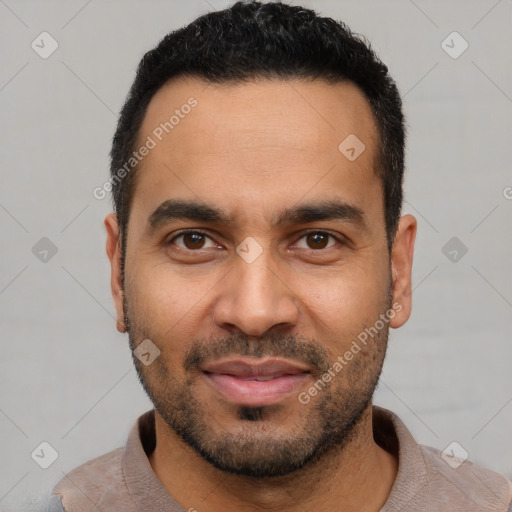 Joyful latino young-adult male with short  black hair and brown eyes
