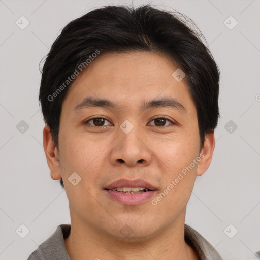 Joyful asian young-adult male with short  brown hair and brown eyes