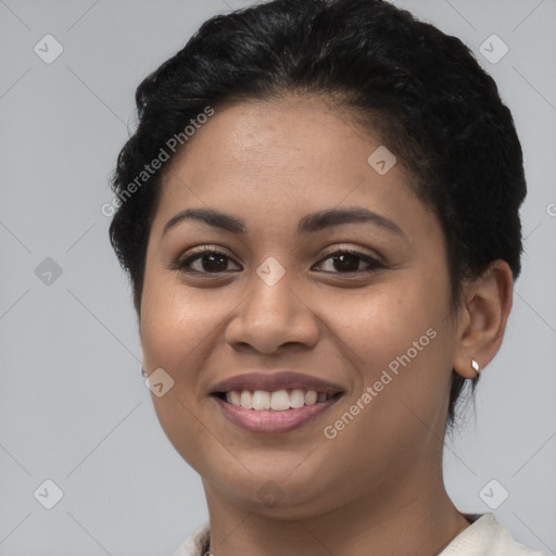 Joyful latino young-adult female with short  brown hair and brown eyes