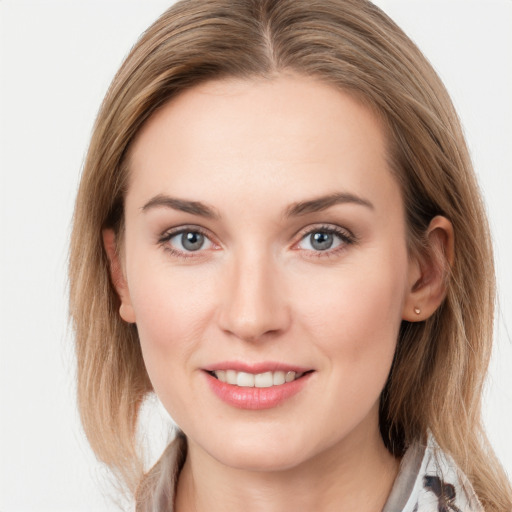 Joyful white young-adult female with medium  brown hair and blue eyes