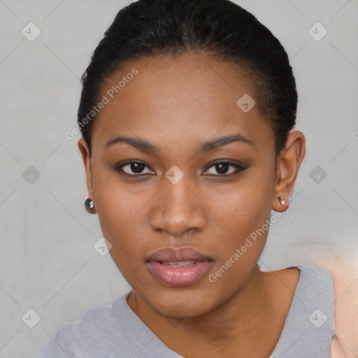 Joyful black young-adult female with short  black hair and brown eyes