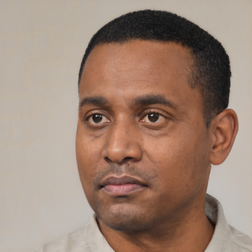 Neutral black young-adult male with short  black hair and brown eyes