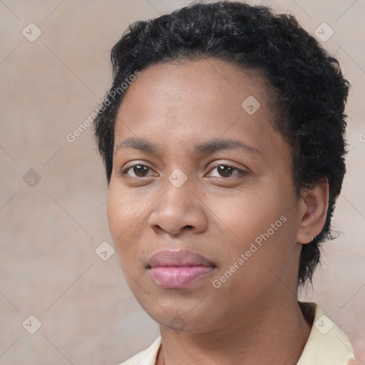 Joyful black young-adult female with short  black hair and brown eyes