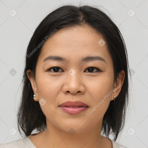 Joyful asian young-adult female with medium  brown hair and brown eyes