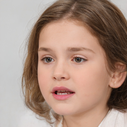 Joyful white child female with medium  brown hair and brown eyes