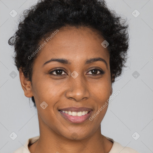 Joyful black young-adult female with short  brown hair and brown eyes