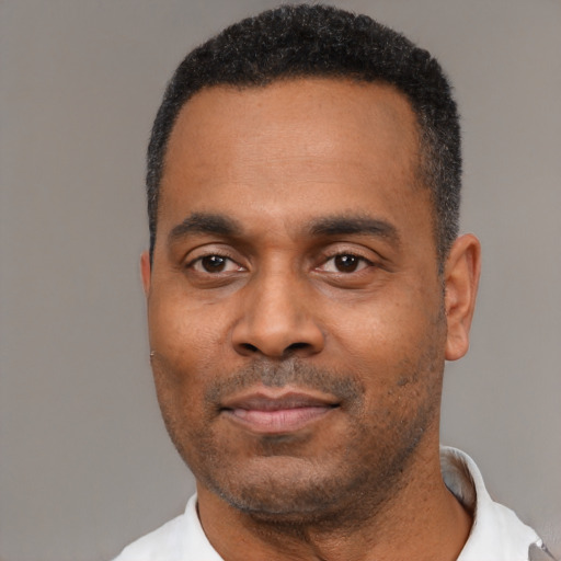 Neutral black adult male with short  black hair and brown eyes
