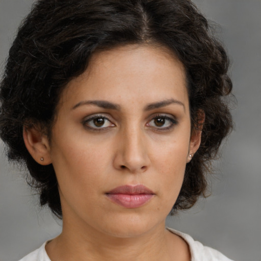 Neutral latino young-adult female with medium  brown hair and brown eyes