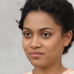 Joyful latino young-adult female with medium  black hair and brown eyes