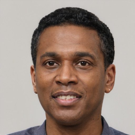 Neutral latino adult male with short  black hair and brown eyes