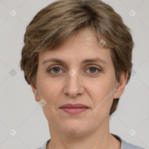 Joyful white adult female with short  brown hair and grey eyes