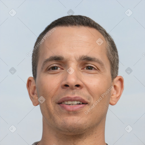 Joyful white adult male with short  brown hair and brown eyes