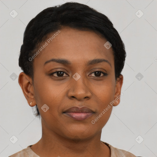 Joyful black young-adult female with short  black hair and brown eyes