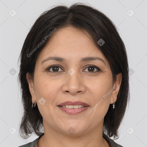 Joyful white adult female with medium  brown hair and brown eyes