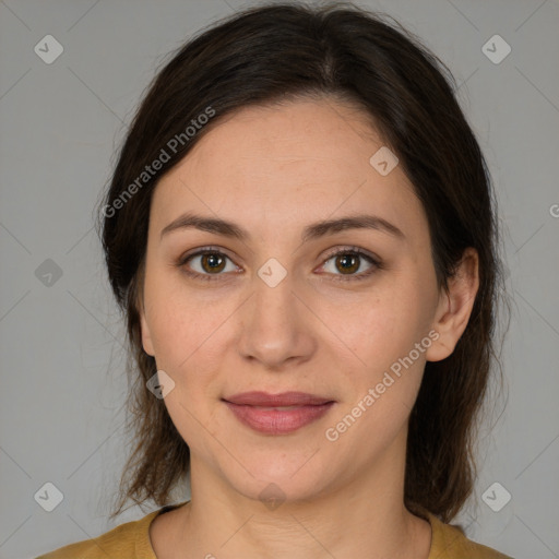 Joyful white adult female with medium  brown hair and brown eyes