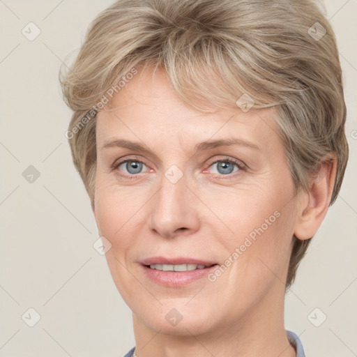 Joyful white adult female with short  brown hair and grey eyes