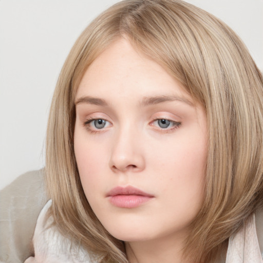 Neutral white young-adult female with long  brown hair and grey eyes