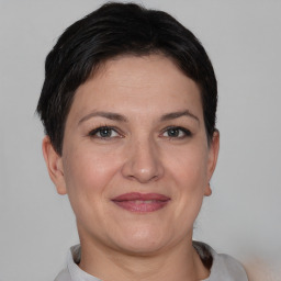 Joyful white adult female with short  brown hair and brown eyes