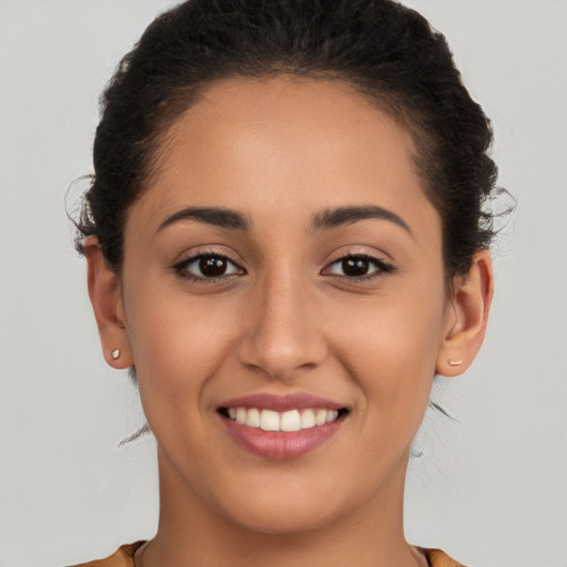 Joyful white young-adult female with long  brown hair and brown eyes