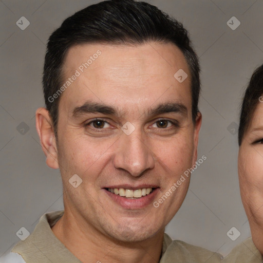 Joyful white adult male with short  brown hair and brown eyes