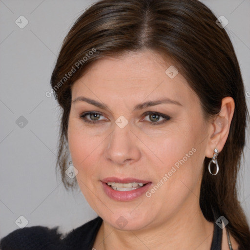 Joyful white adult female with medium  brown hair and brown eyes