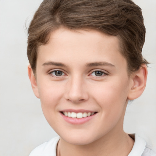 Joyful white child female with short  brown hair and brown eyes