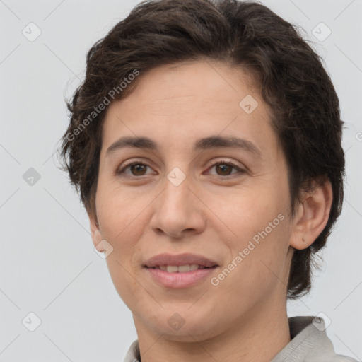 Joyful white adult female with short  brown hair and brown eyes