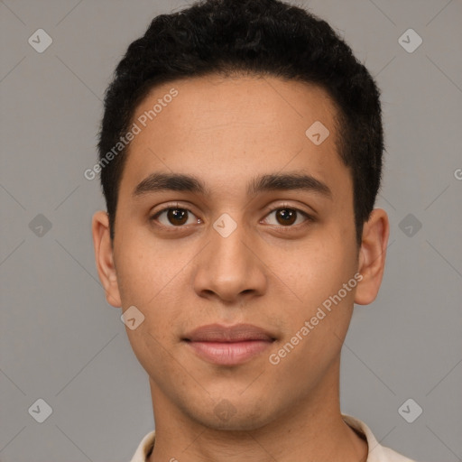 Joyful latino young-adult male with short  brown hair and brown eyes