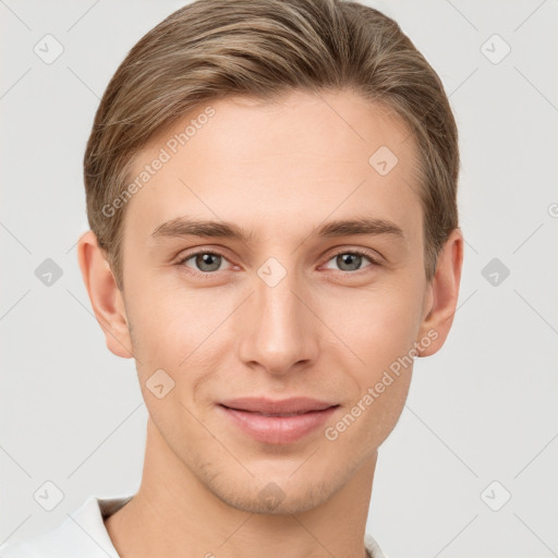 Joyful white young-adult male with short  brown hair and grey eyes